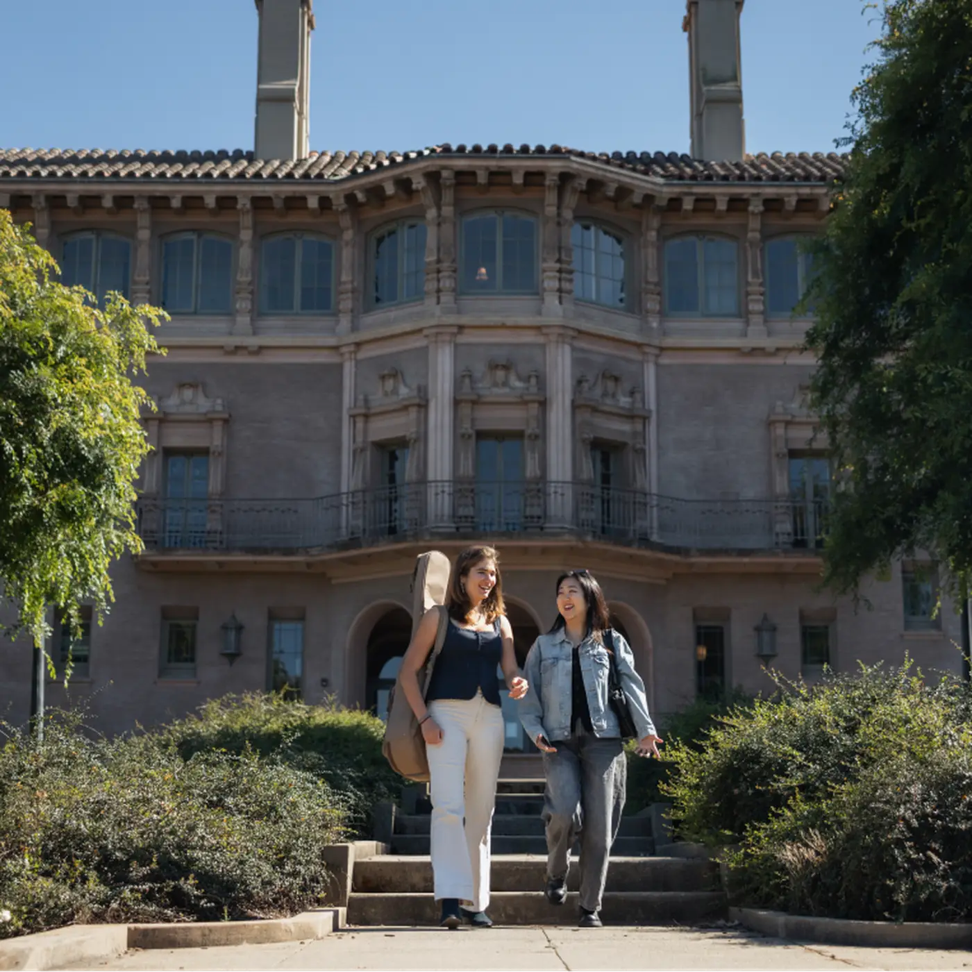 Hoffmann standing on campus with another student