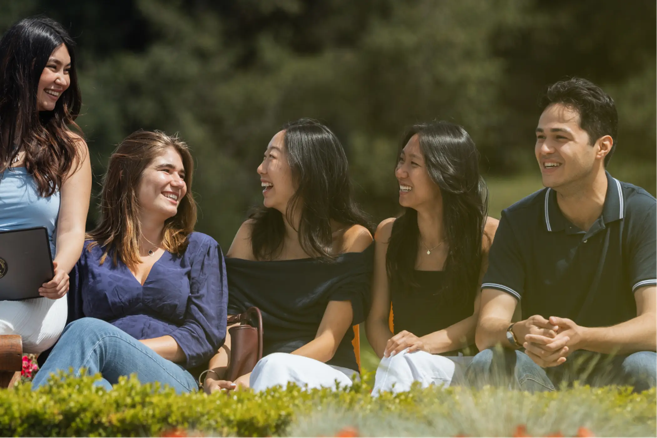 A group of students sitting outside with Hoffmann