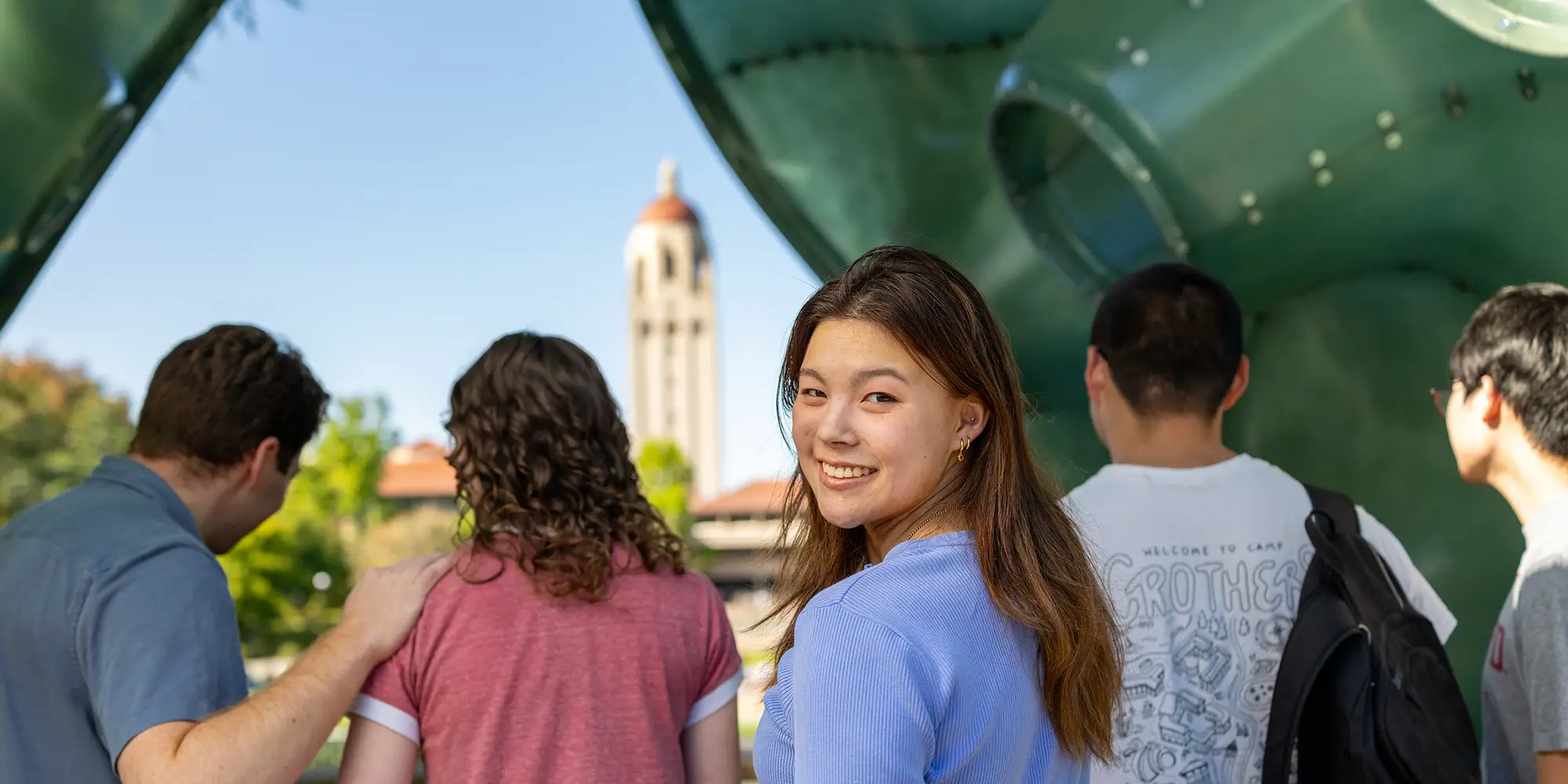students smile on campus