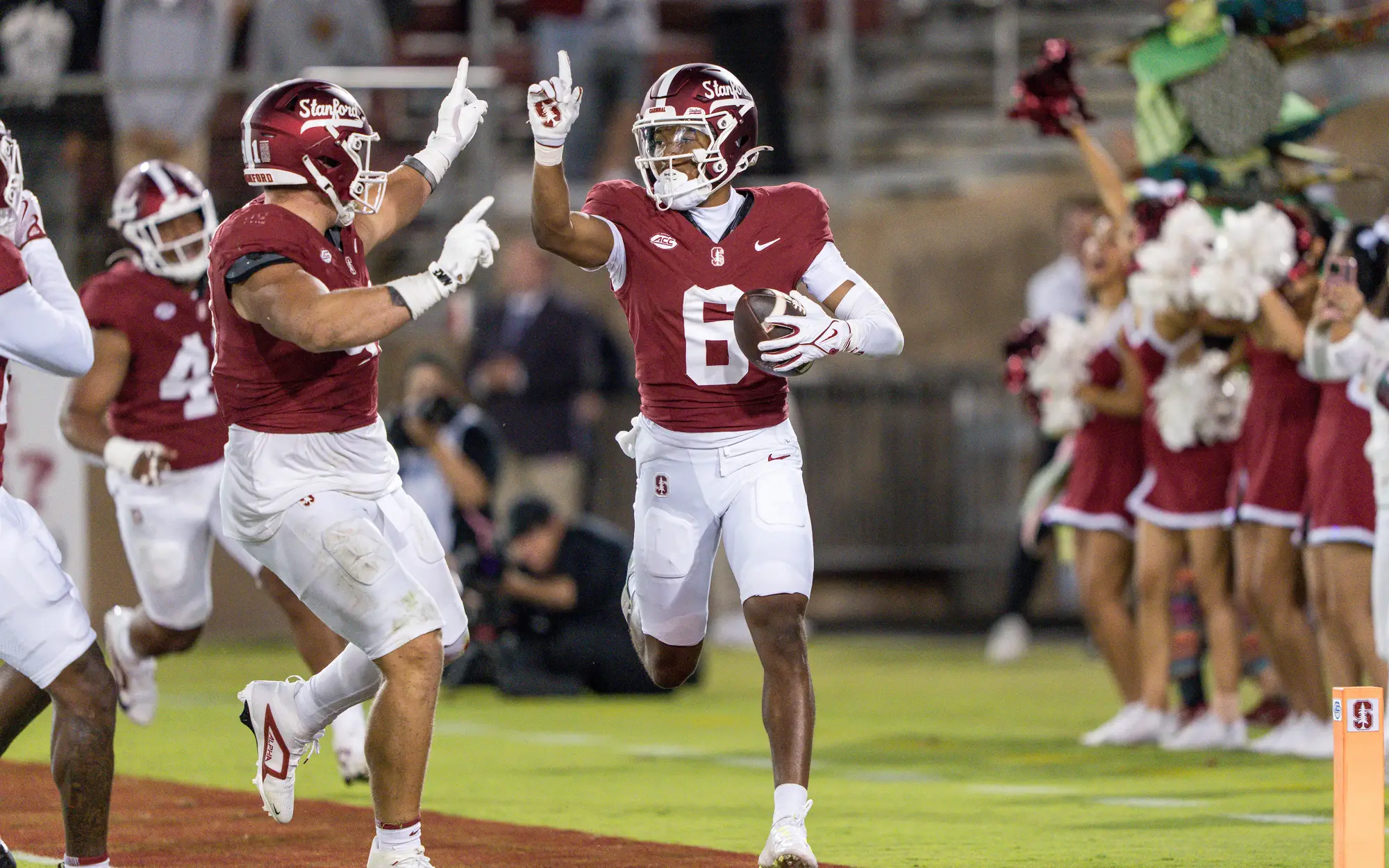 Collin Wright runs with the ball