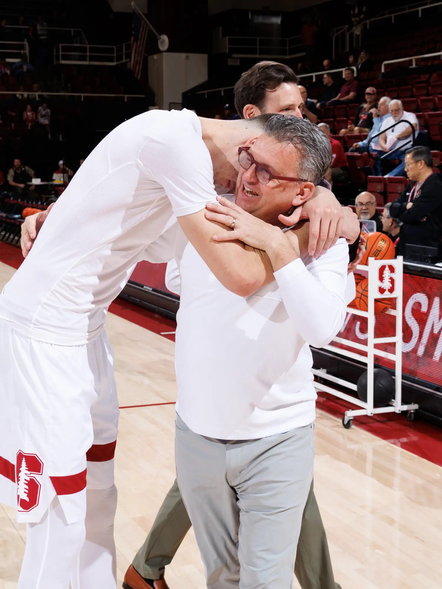 Kyle Smith being hugged by Maxime Raynaud.