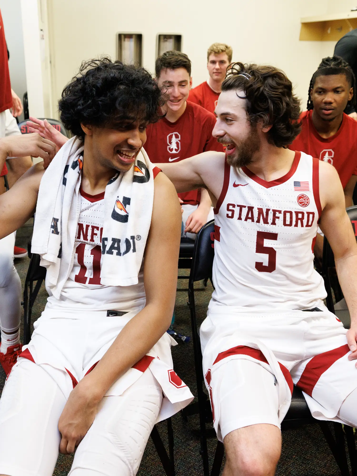 Ryan Agarwal and Benny Gealer sitting down, smiling and congratulating each other.
