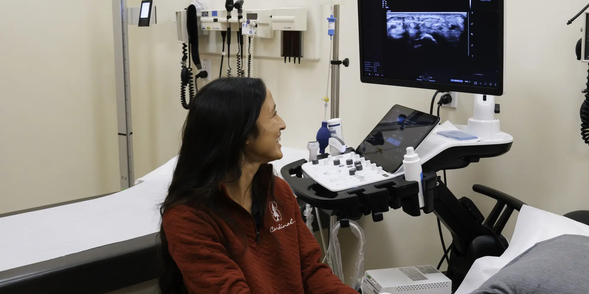 A member of the athletic's team looks at a scan of an athlete 