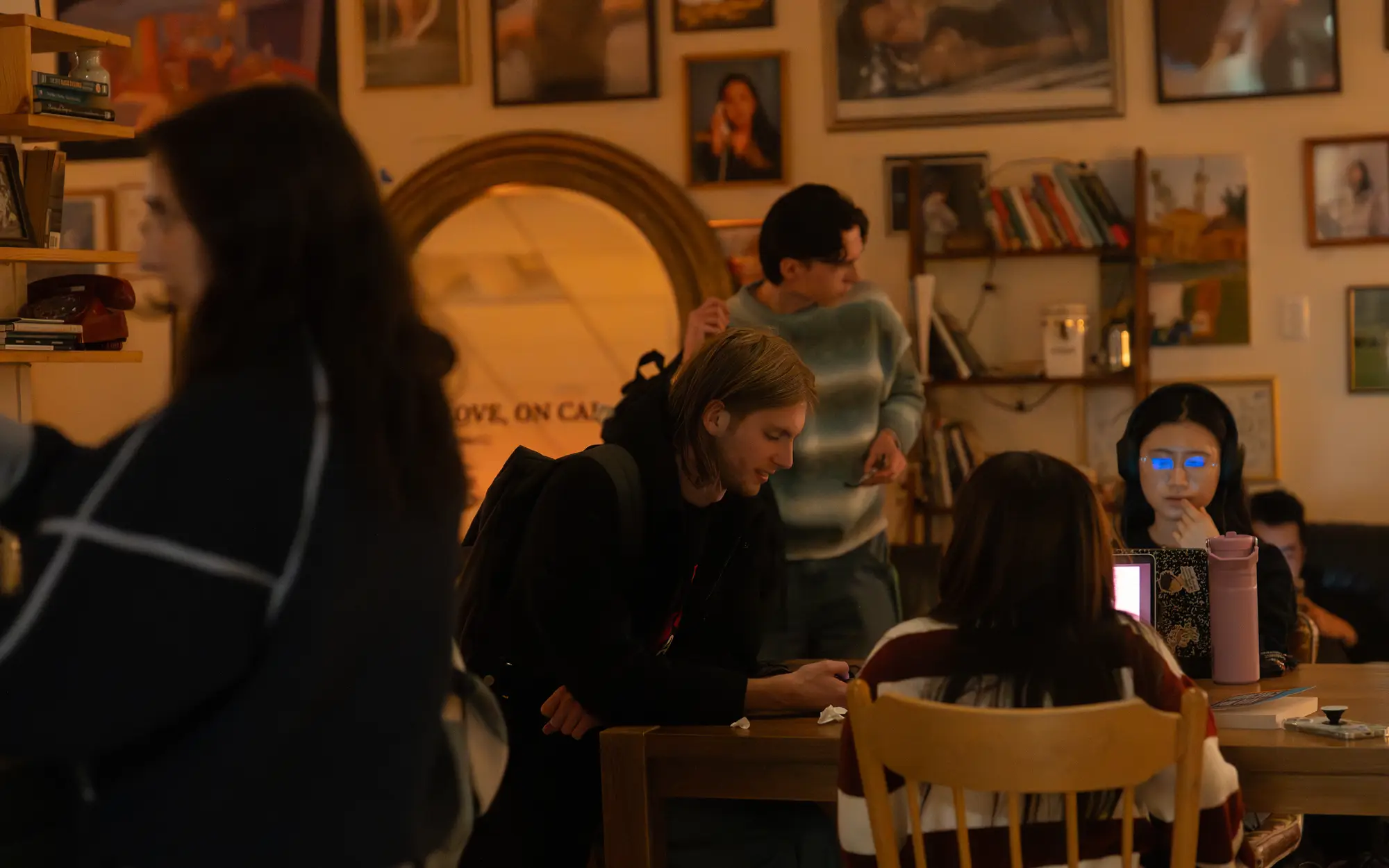 students studying at a table at On Call Cafe