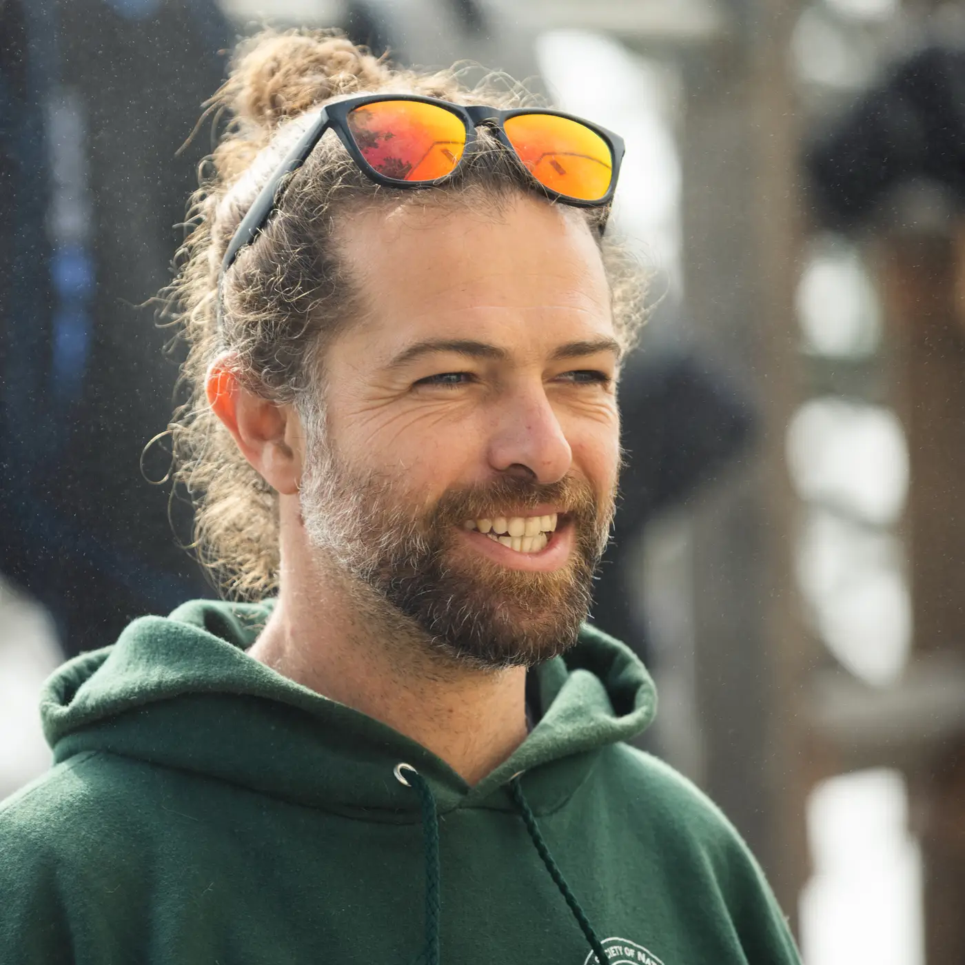 Arafeh Dalmau smiles in front of the ocean