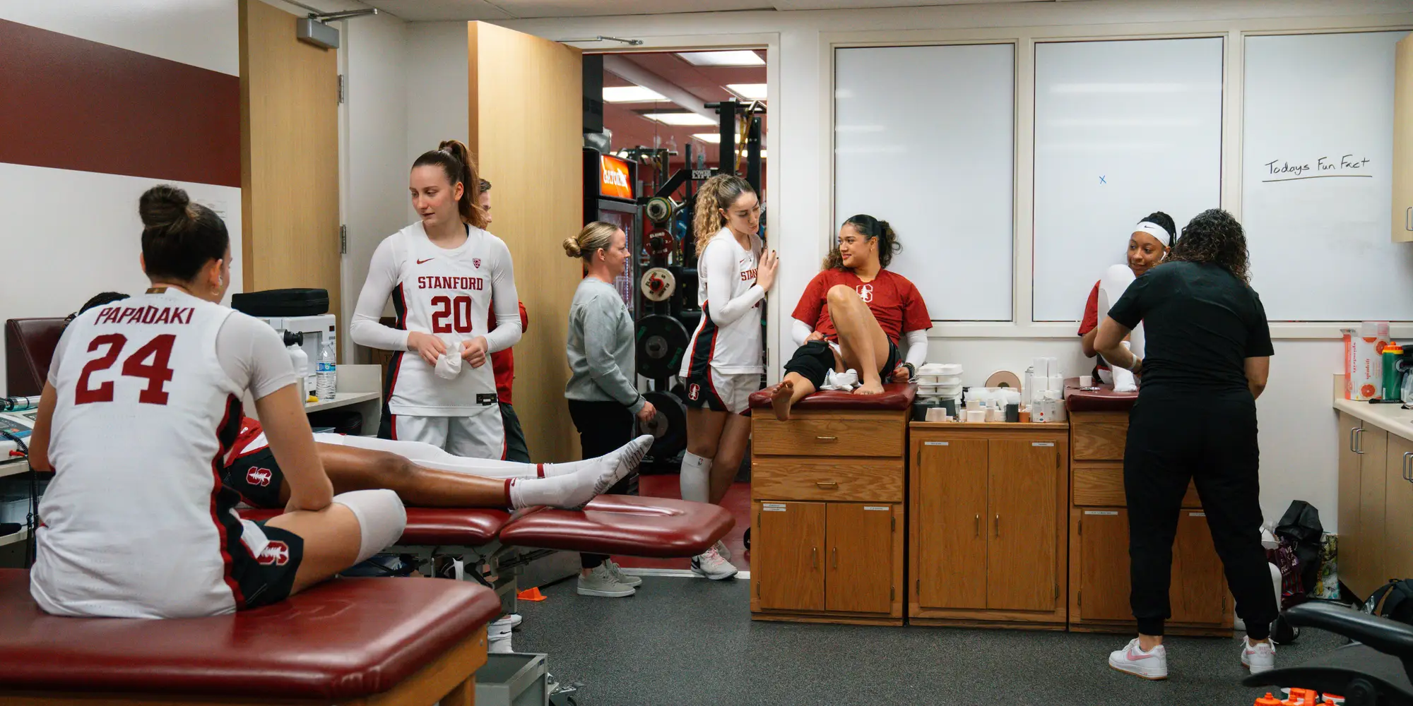 Women's basketball players in the training room