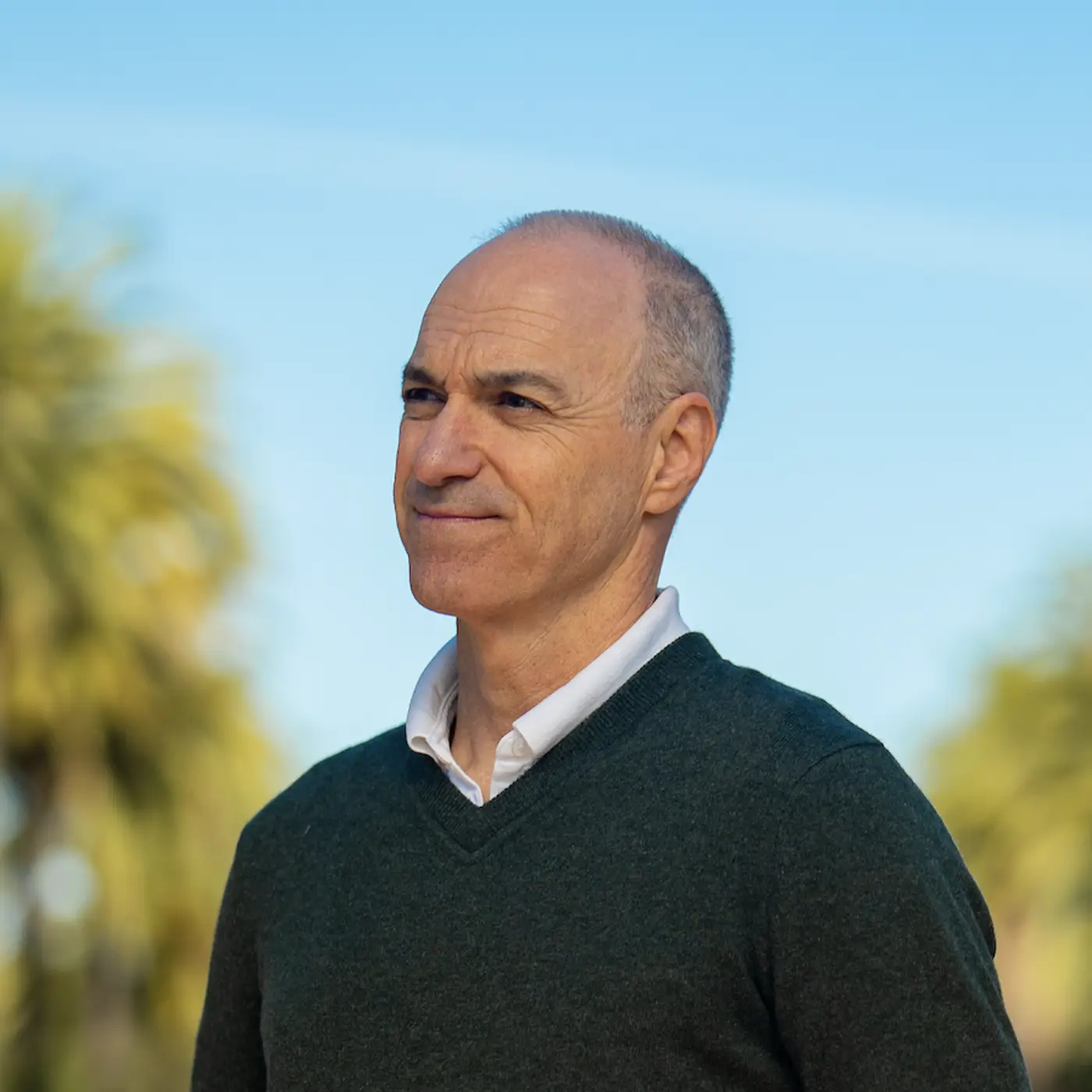 David Fiorentino looks off in the distance on Palm Drive on Stanford campus.