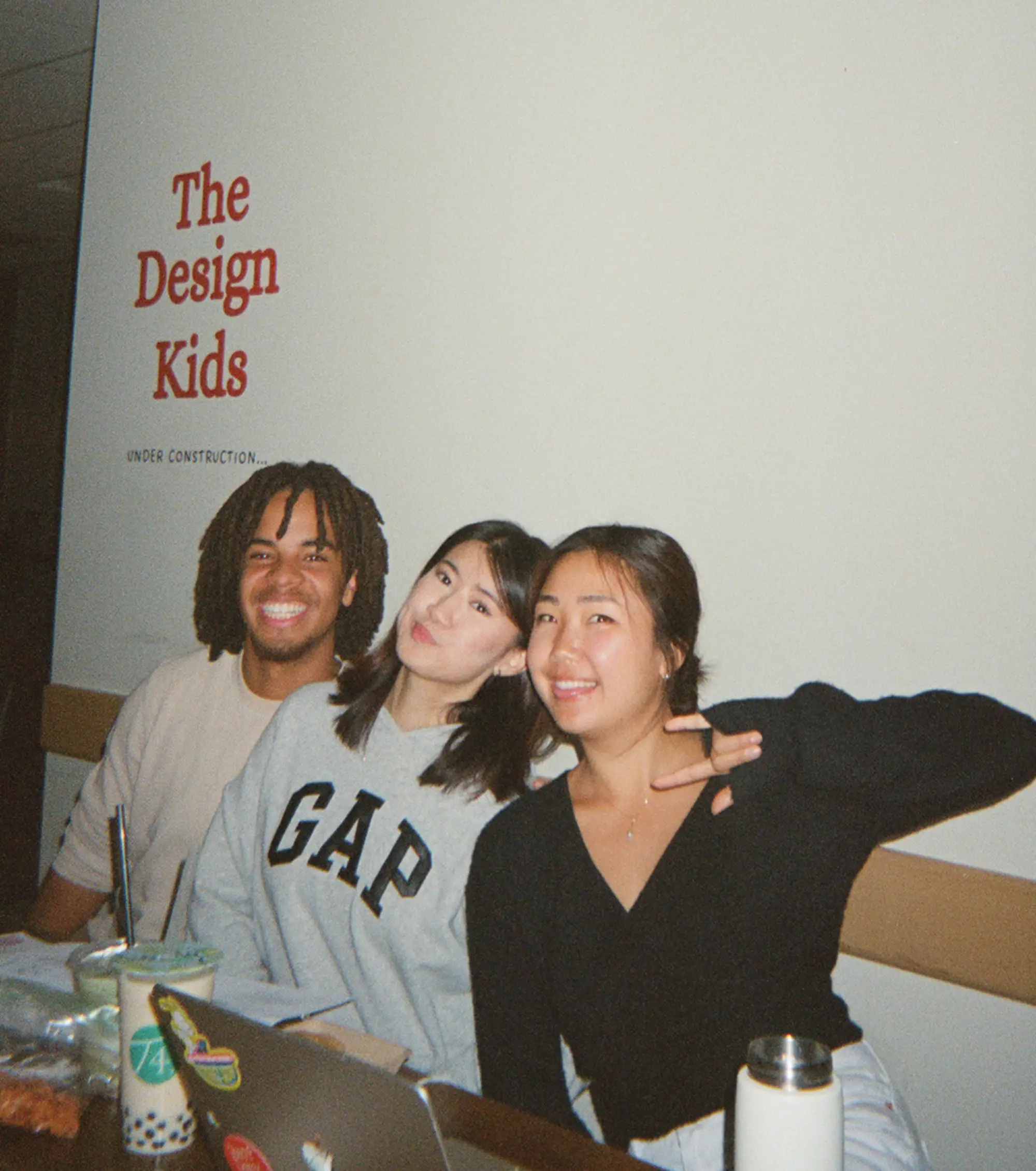 3 students smiling at camera