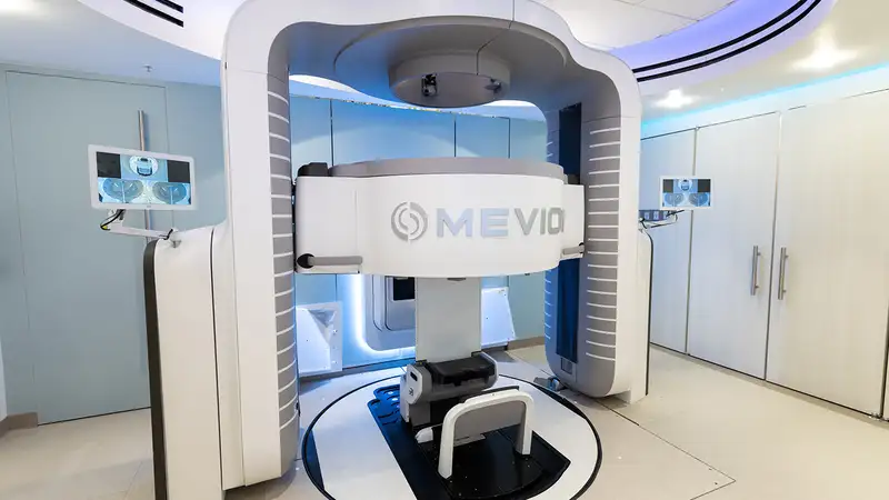 A modern medical imaging machine, designed for advanced diagnostic scans, featuring a central scanning area and sleek, futuristic design.