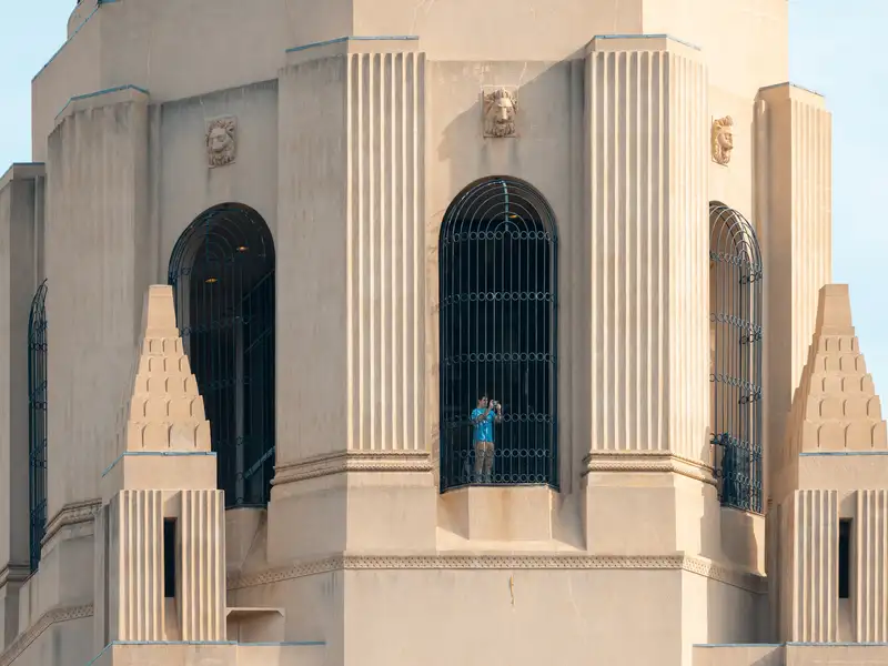 A person taking a photograph from the top of Hoover tower