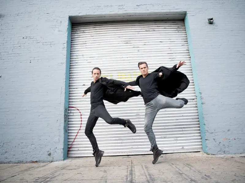 Jason Oremus McLeish jumping with his creative partner in the dance duo Hammerstep