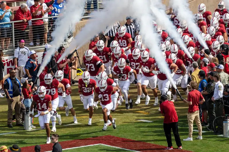 Football team running into stadium