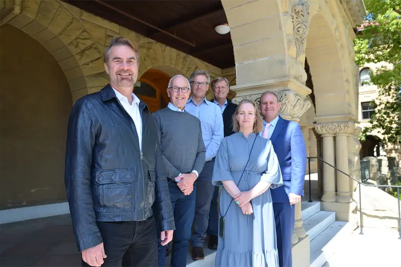 A group photo of Frank McCourt, Jr. (second from left) and members of the faculty steering committee.