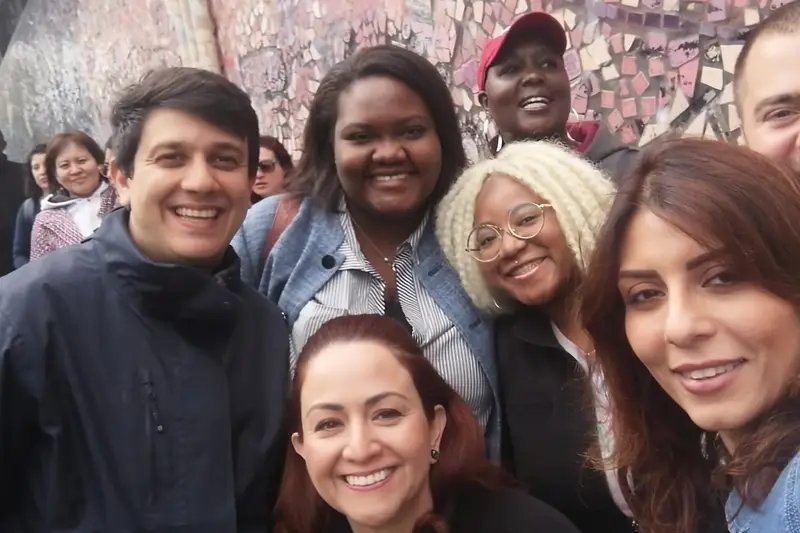 A group of summer fellows smile for the camera