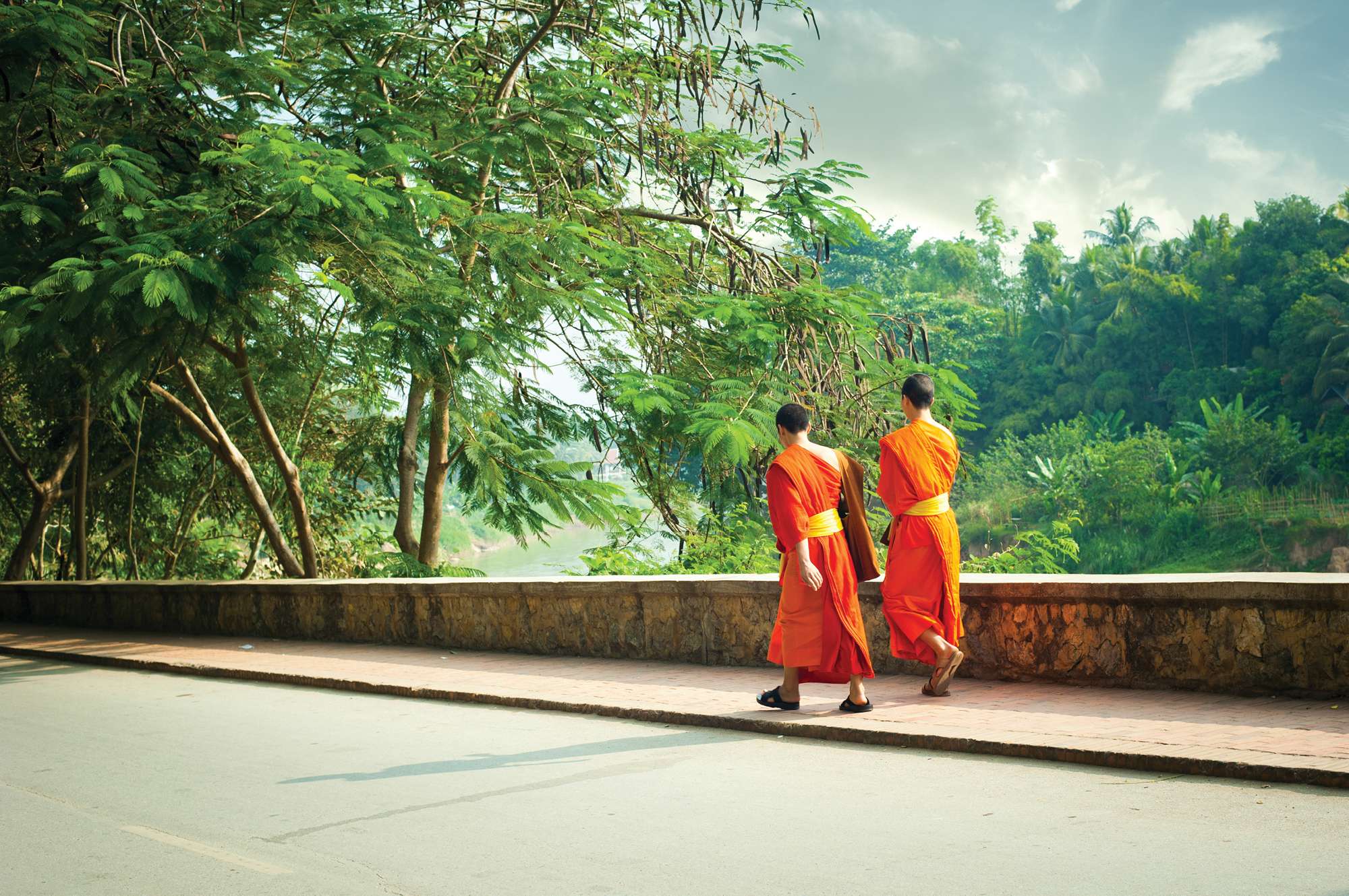 two monks walking along road