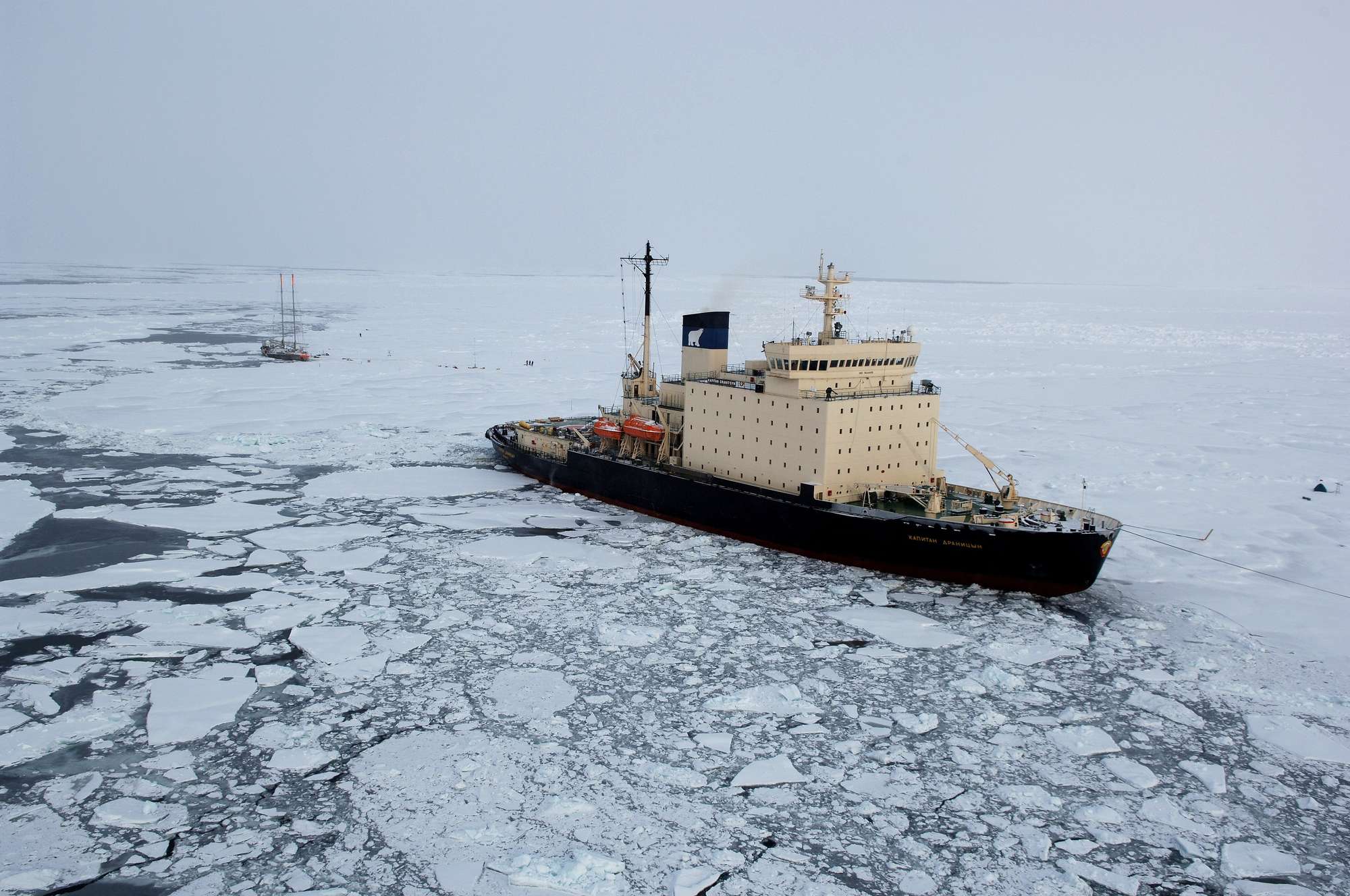 An ice breaker ship goes through ice