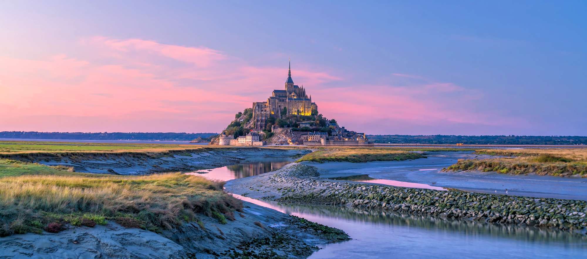 Mont Saint-Michel at sunset twilight in Normandy, northern France