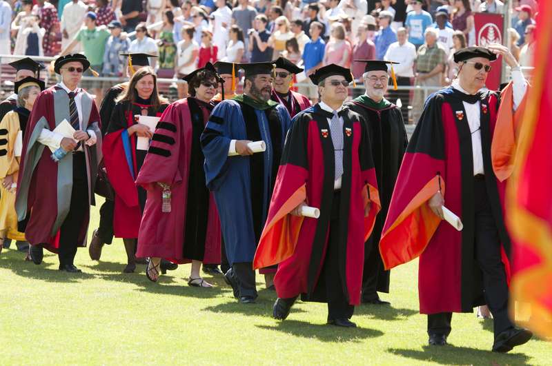 Faculty walking into Stanford stadium for commencement ceremonies