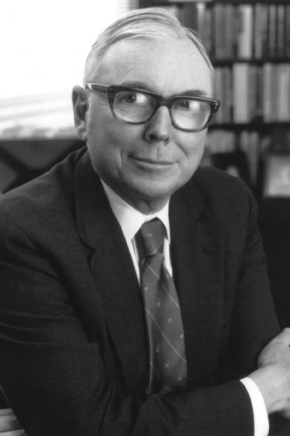 A black and white portrait of Munger