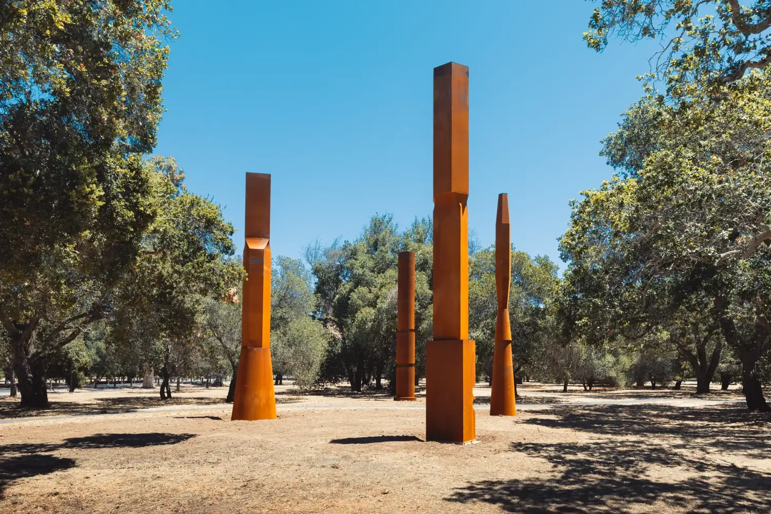 Beverly Pepper's art columns stand on campus